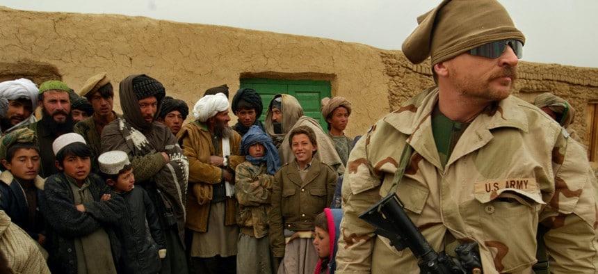 Military personnel with local villagers in Afghanistan