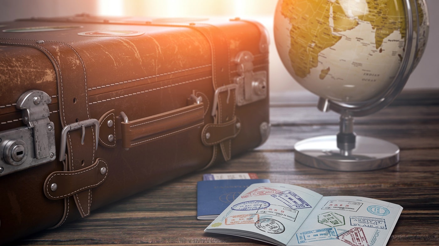 suitcase globe and passport