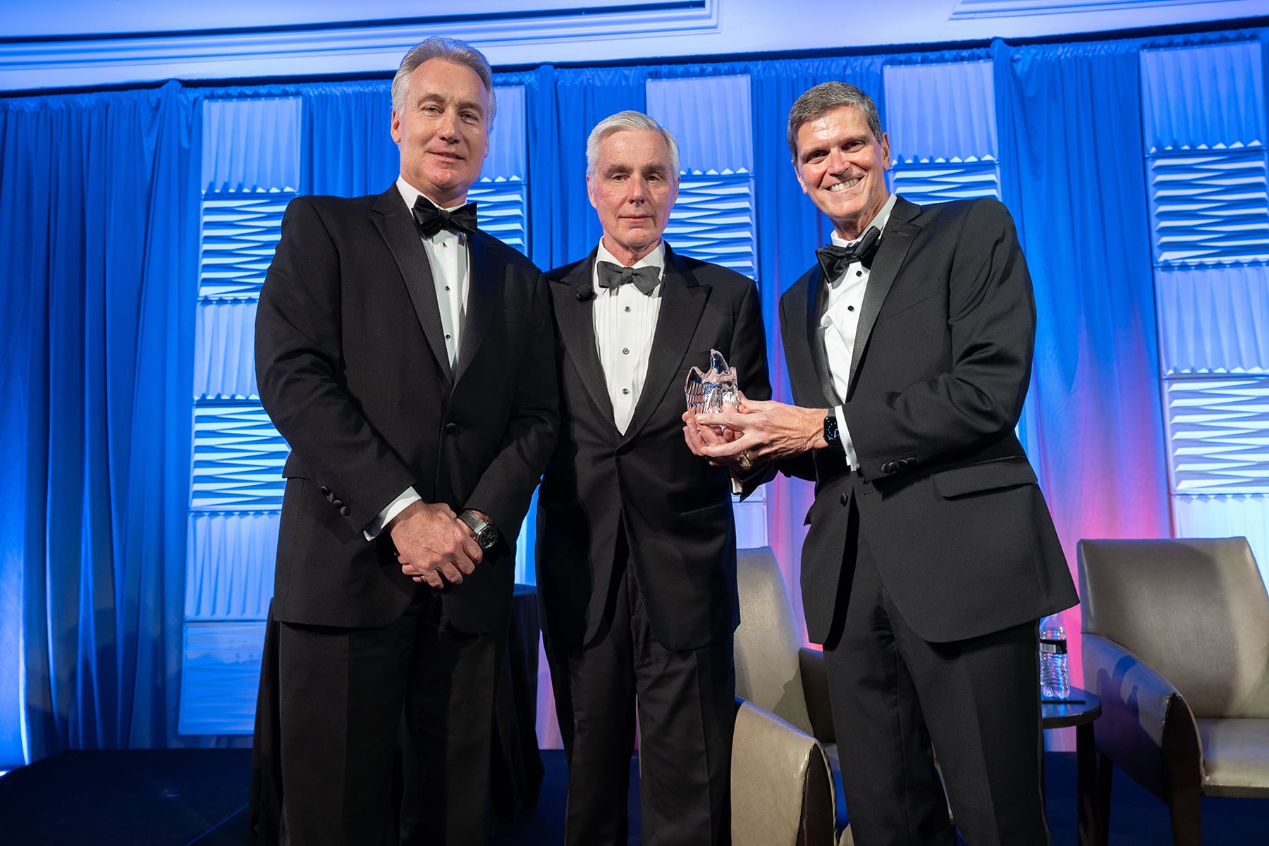 William Flynn (center) is presented with the Eisenhower Award.