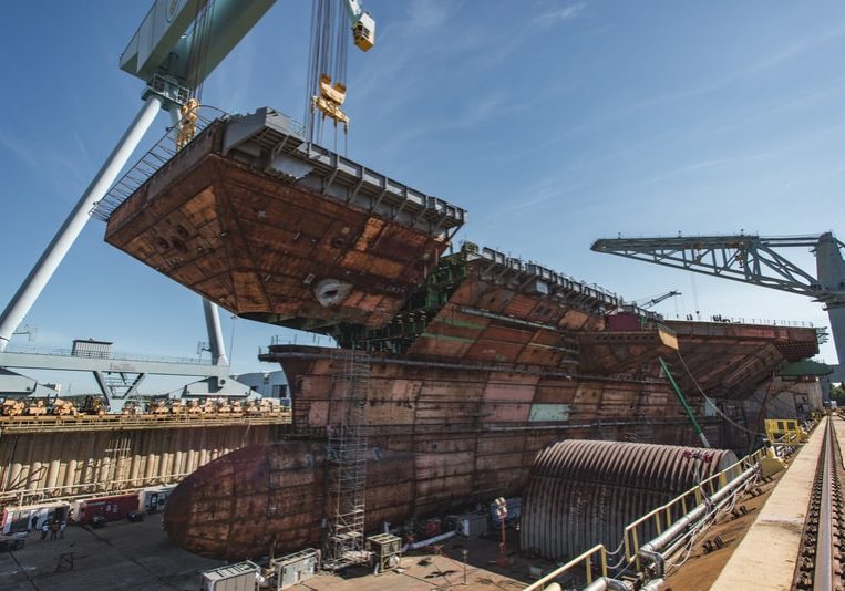 190710-N-N2201-100
NEWPORT NEWS, Va. (July 10, 2019) The upper bow unit of the future  aircraft carrier USS John F. Kennedy (CVN 79) is fitted to the primary structure of the ship, July 10, 2019, at Huntington Ingalls Industries Newport News Shipbuilding. John F. Kennedy is the second Gerald R. Ford-class aircraft carrier and the second aircraft carrier to be named after the 35th president. The 1,096-foot hull is longer than three football fields and more than 3,000 shipbuilders and 2,000 suppliers from across the country are supporting construction of the ship. The christening for John F. Kennedy is scheduled for late 2019. (U.S. Navy photo courtesy of Huntington Ingalls Industries by Matt Hildreth/Released)