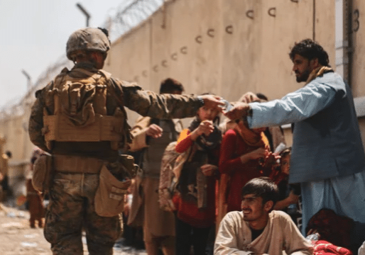 US military personnel guard evacuees in Kabul, Afghanistan