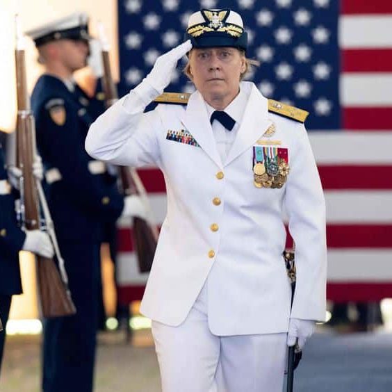 WSJ Biden Swears In First Female Coast Guard Commandant